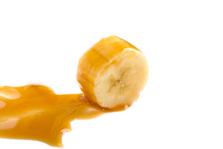 banana and caramel isolated on white backgroundの写真素材