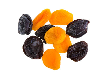 Dried apricots and prunes on a white backgroundの写真素材