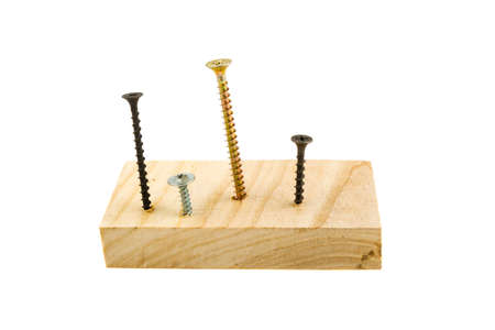 Screws screwed into wooden plank, white backgroundの写真素材