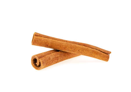 two cinnamon sticks isolated on white backgroundの写真素材