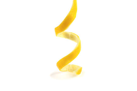 peeled lemon spiral on a white backgroundの写真素材