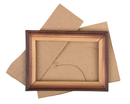 pieces of cardboard and wooden frame on a white backgroundの写真素材
