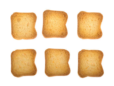 bread in dried small pieces, crackers isolated on white backgroundの写真素材