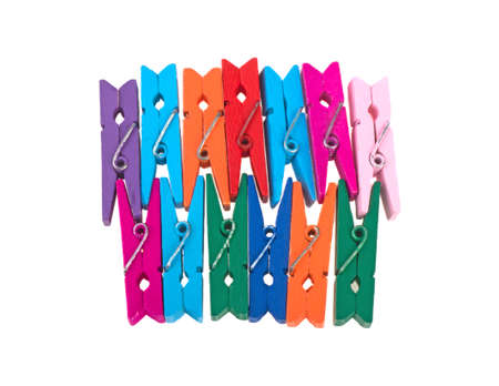 small colored wooden clothes pins isolated on white background