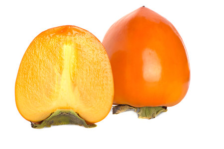 Half of a persimmon fruit isolated on a white background.の写真素材