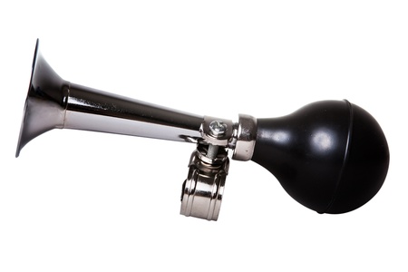 silver vintage bicycle air horn isolated on whiteの写真素材