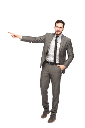 elegant man pointing in one direction on white backgroundの写真素材