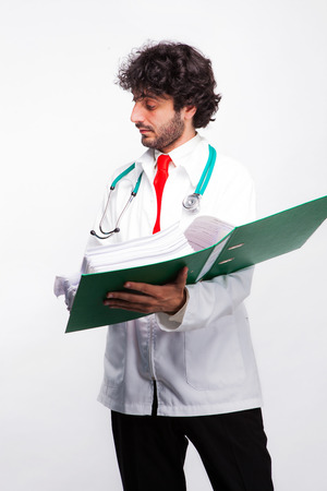 male doctor showing folder to other perssonの写真素材