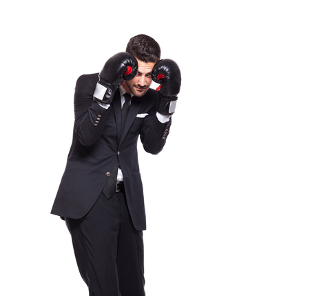 Competitive businessman in boxing gloves. Isolated on whiteの写真素材