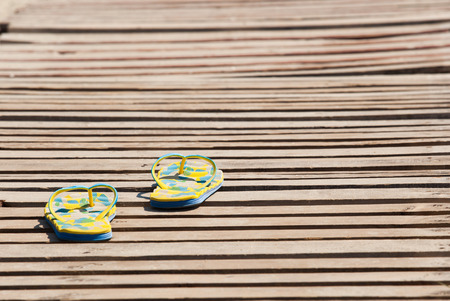 flip-flops on the wooden floorの写真素材