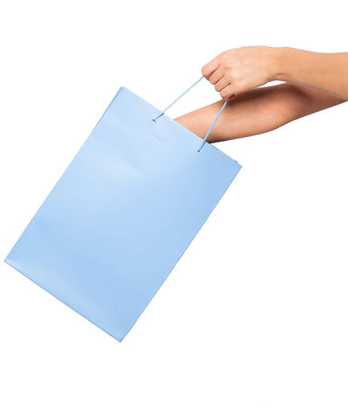 woman hands looking into a blue shopping bag on white backgroundの写真素材