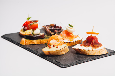 finger food on vulcanic stoneの写真素材