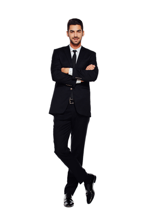 elegant businessman looking at camera with reliability isolated on white backgroundの写真素材