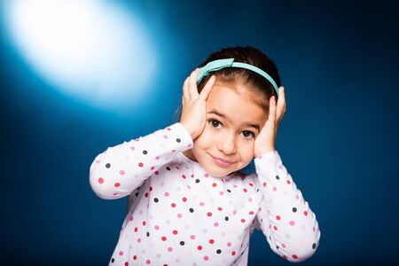 little girl with green headband with bow, whineの写真素材