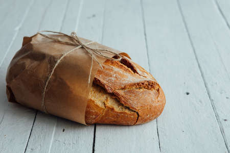 rustic table with bread and seeds , organic food