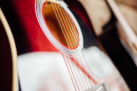 guitar leaning on a old wooden porchの写真素材