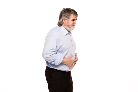 old man with stomach pain, isolated on whiteの写真素材