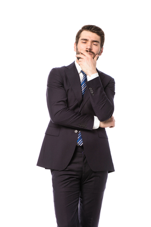 corporate man, elegant businessman standing on white background thinking about somethingの写真素材