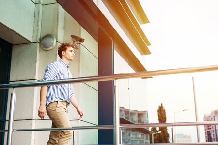 young man leaving the office at the end of the dayの写真素材