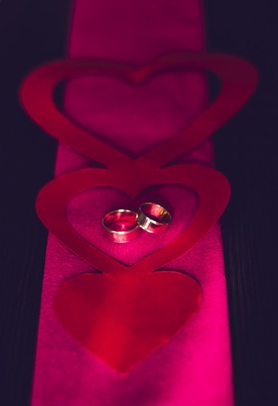 Gold wedding rings in the red zoneの写真素材