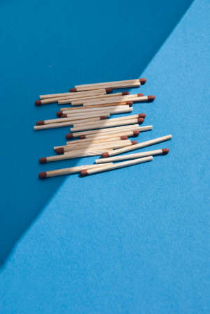 Matches on light blue backgroundの写真素材