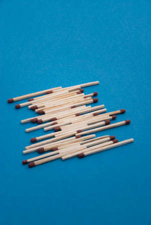 Matches on light blue backgroundの写真素材