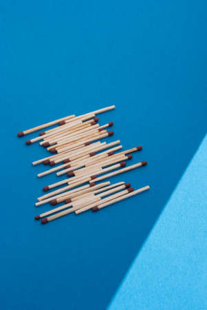 Matches on light blue backgroundの写真素材