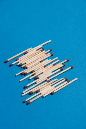 Matches on light blue backgroundの写真素材