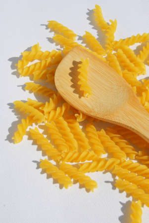Rotini Pasta on white canvas background. High Angle View.の写真素材