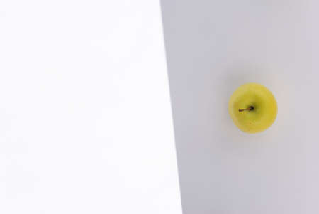 Fresh Yellow Apple on light greybackground. の写真素材