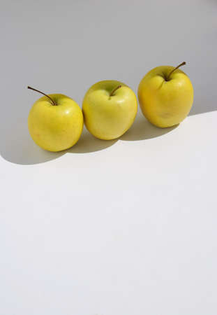 Fresh Yellow Apples on light greybackground. の写真素材