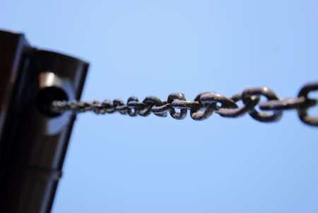 Chain on blue background. Selective focus