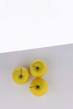 Fresh Yellow Apples on light greybackground. の写真素材