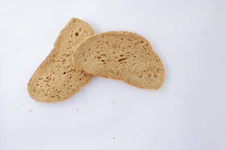 Slices of Bread on white canvas background. Above view