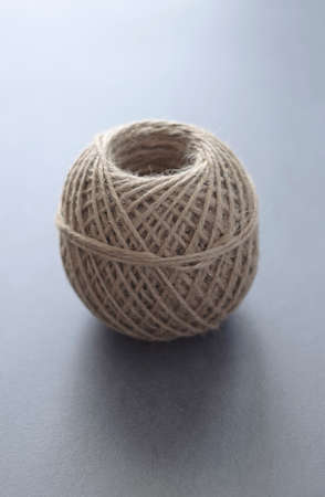 Roll of twine on dark background. Shallow depth of field.の写真素材