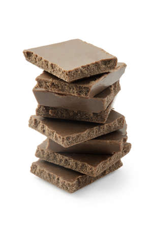 Stack of brown chocolate isolated on white background