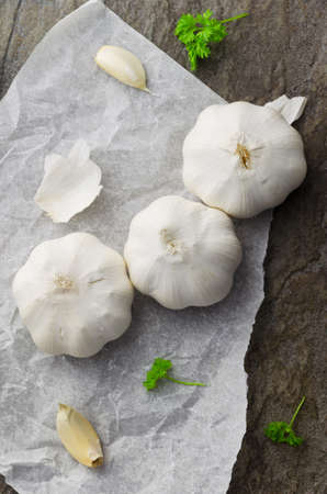 Cloves of garlic. Dark and moody atmosphere