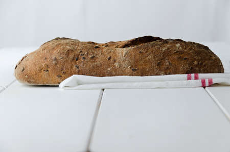 Traditional bread over white wooden tableの写真素材