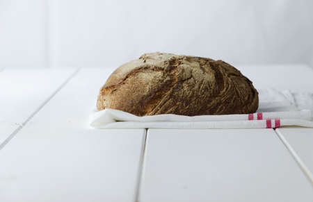 Traditional bread over white wooden tableの写真素材