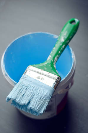 Used paintbrush over dark gray background, above viewの写真素材