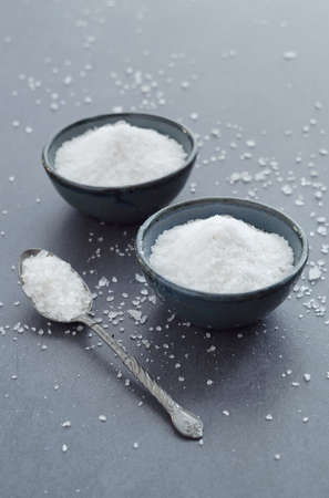 Salt in rustic ceramic bowls, top viewの写真素材