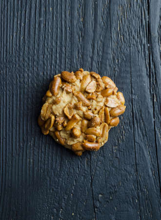 Homemade cookie with peanuts over black wooden table, above viewの写真素材