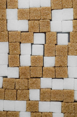 Close up of white and brown sugar cubes well arranged, above viewの写真素材