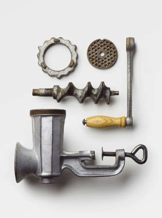 Metal meat grinder well arranged over white background, above viewの写真素材