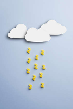 Concept: Raining with raw macaroni over blue background, above viewの写真素材