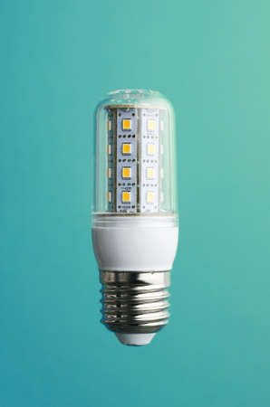 Energy saving SMD led light bulb over green background