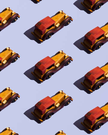 Wooden cars organized over blue backgroundの写真素材