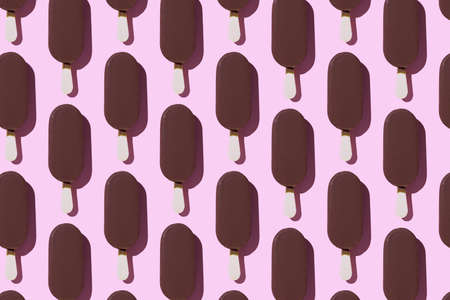Ice cream organized in a row over pink background