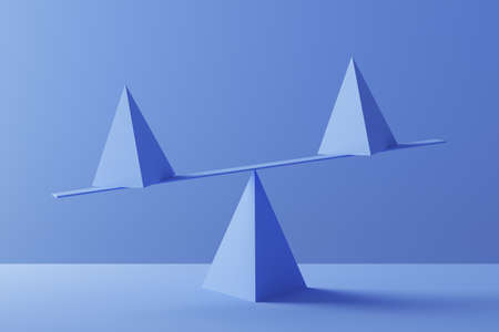 Two pyramids in perfect balance over blueの写真素材