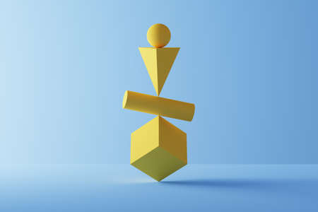 Primitive geometric shapes in perfect balance over blueの写真素材